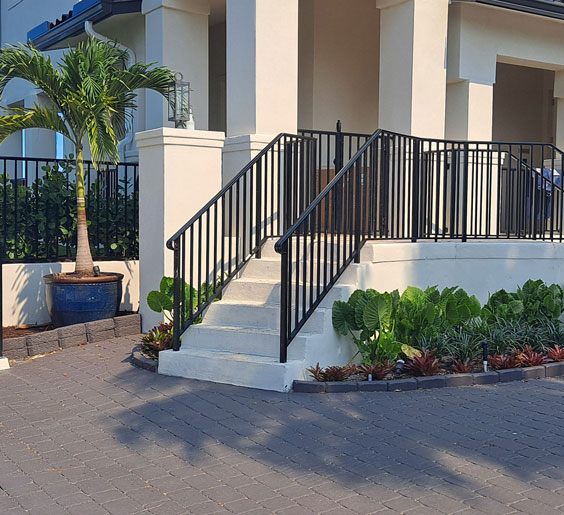 An metal fabricators Fort Lauderdale stairs' railing in front of a house.