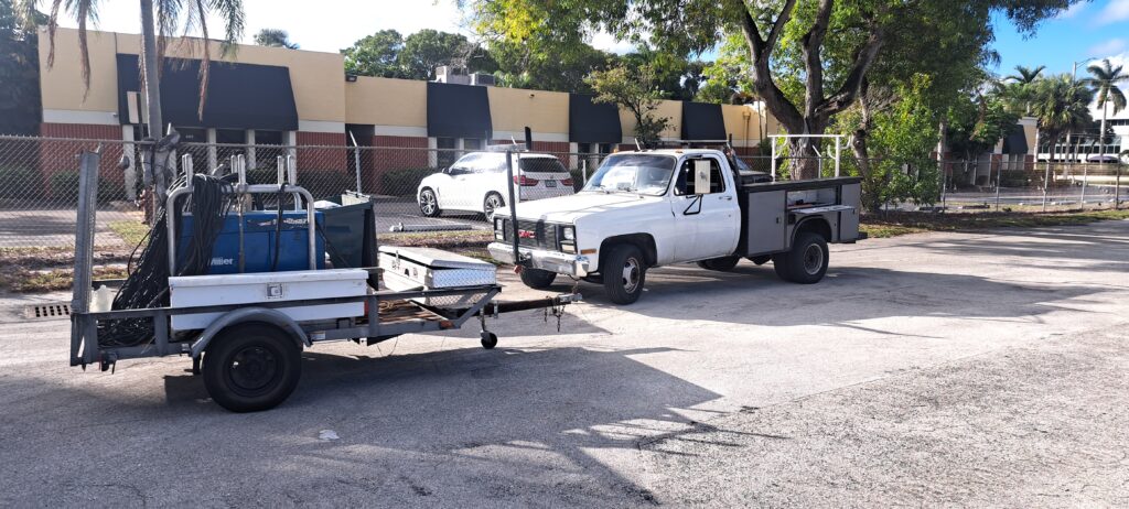 Utility truck and trailer with welding equipment and tools for mobile worksite 1